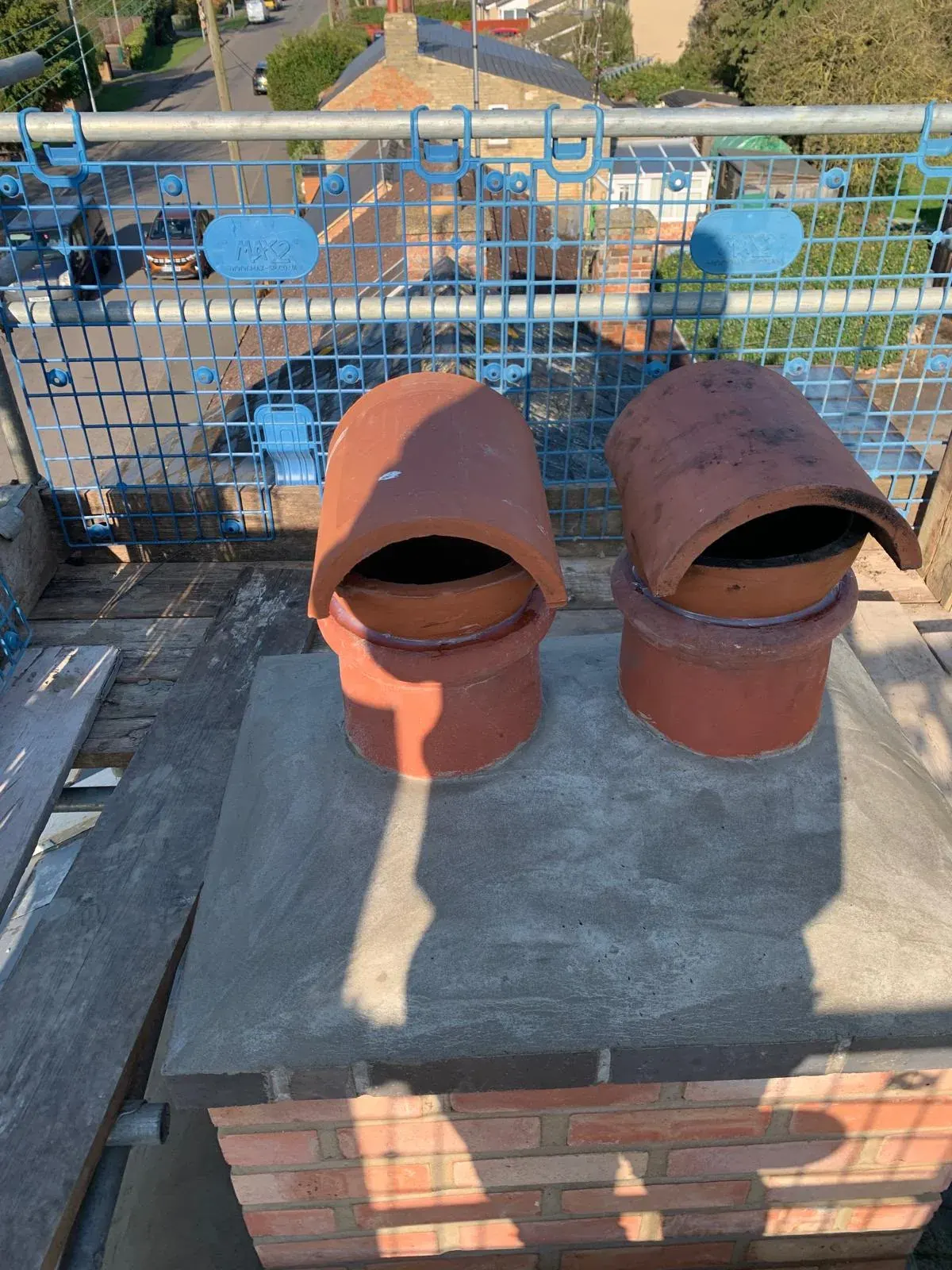 Rebuilt chimney with new clay pots by DJW Roofing & Leadwork